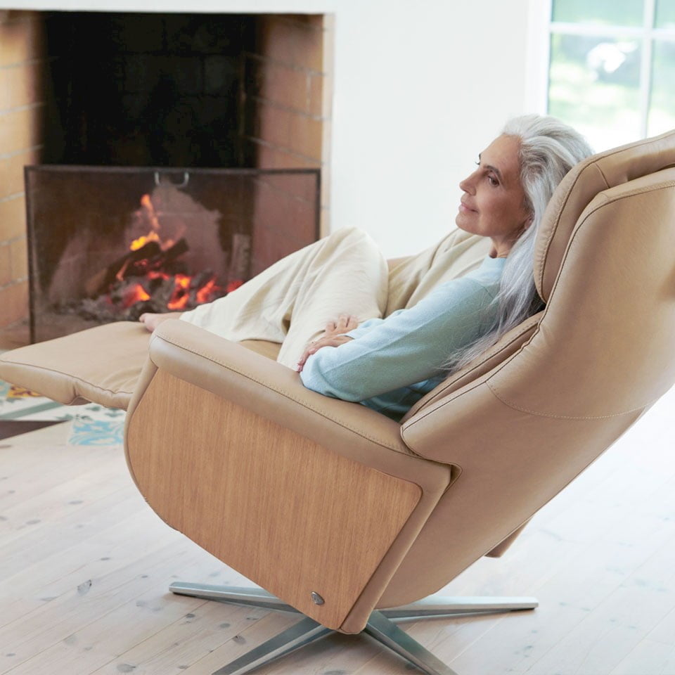 A woman sitting in the Stressless Sam recliner