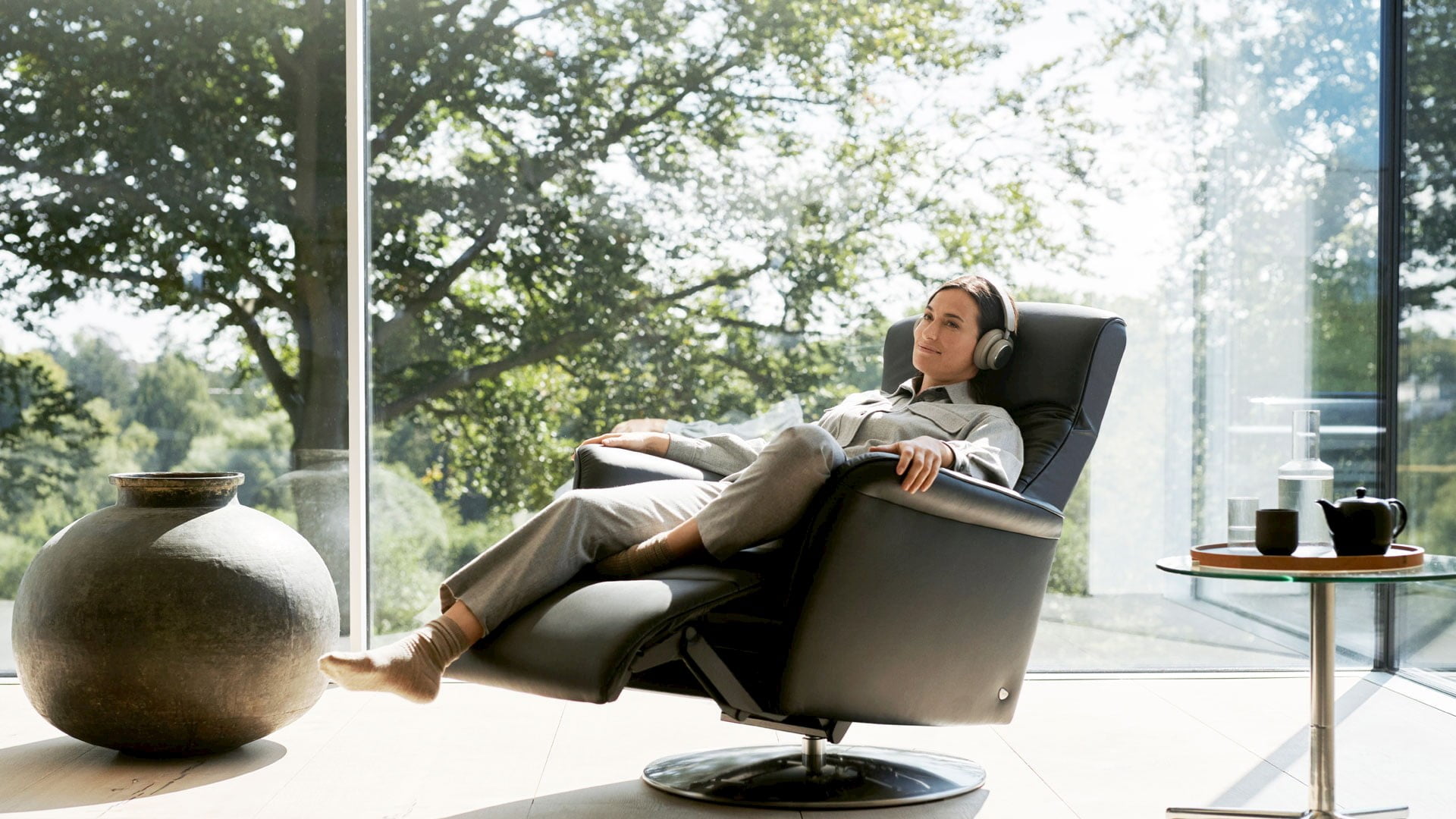 Woman in Stressless Mike motorised recliner