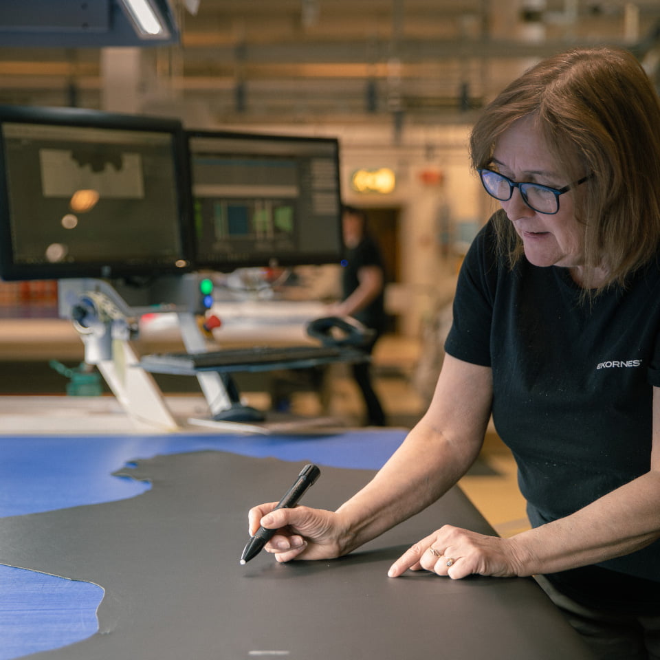 Woman controlling leather hides