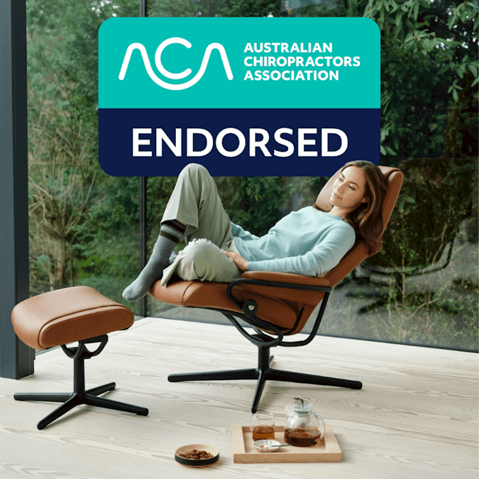 Women seating on a Stressless Paris recliner, with ACA endorsement logo