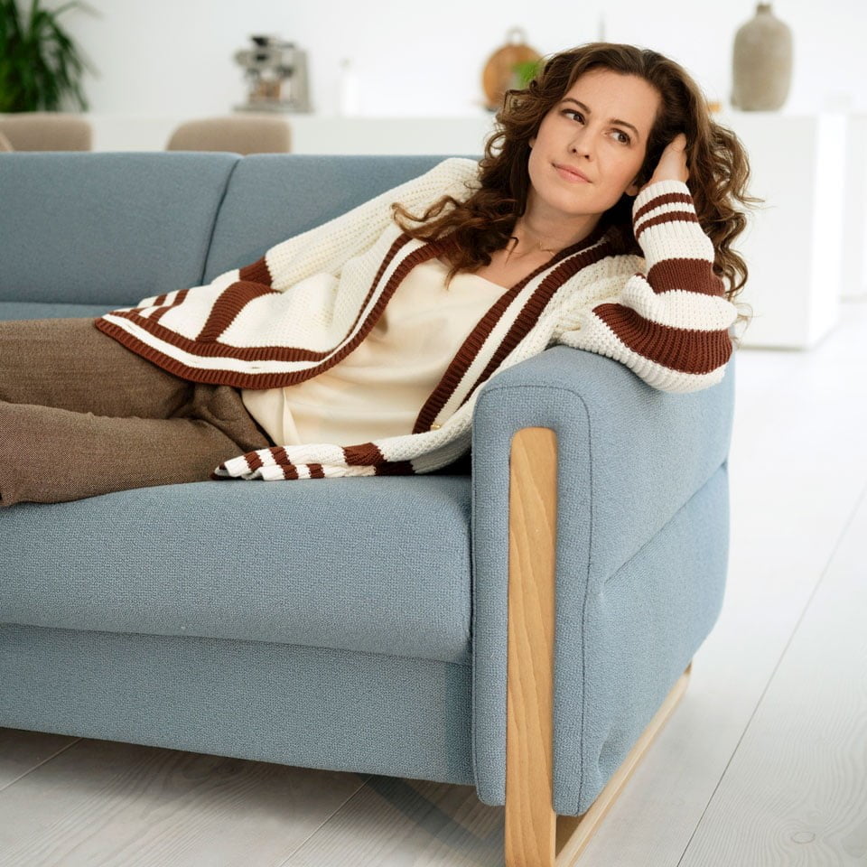 Woman in Stressless® Fiona sofa