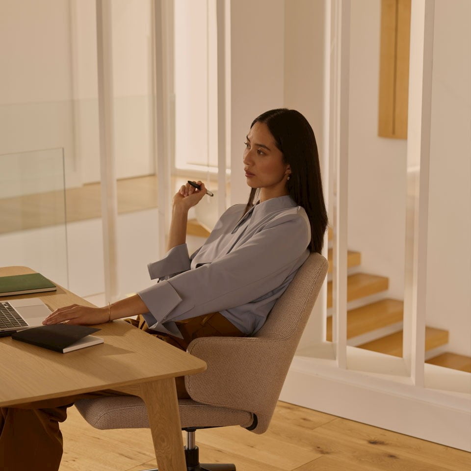 Woman in Stressless home office chair