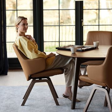 Woman in Stressless Dining chair 