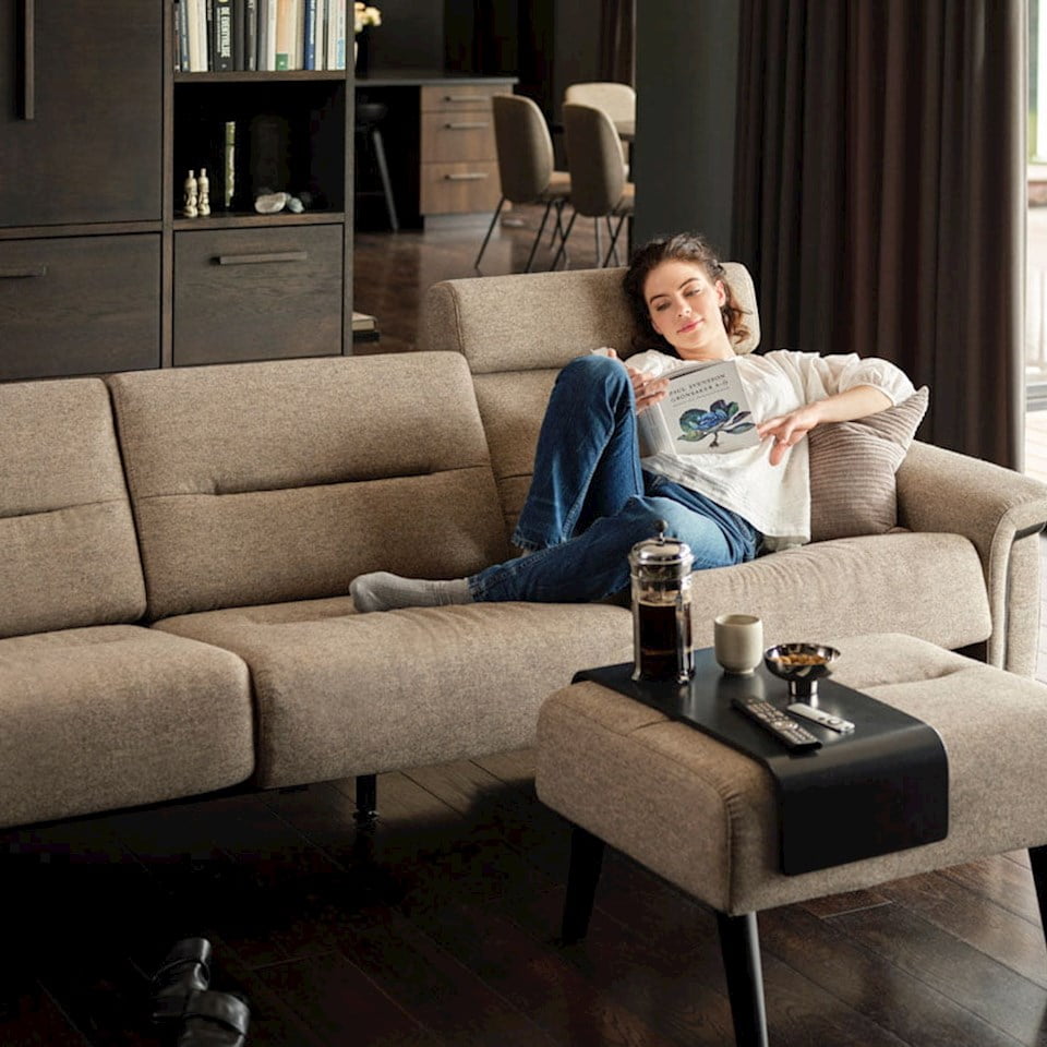 Lady relaxing in Stressless Stella sofa 