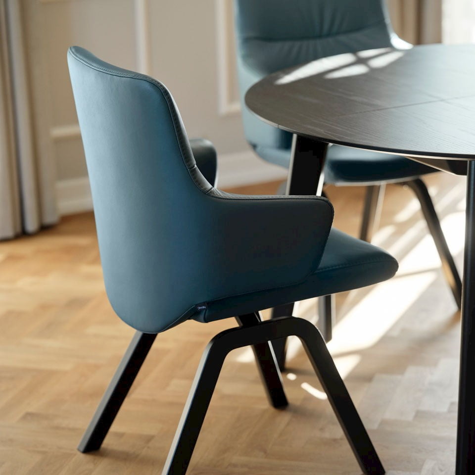 Stressless dining chair shown in Paloma Teal blue leather