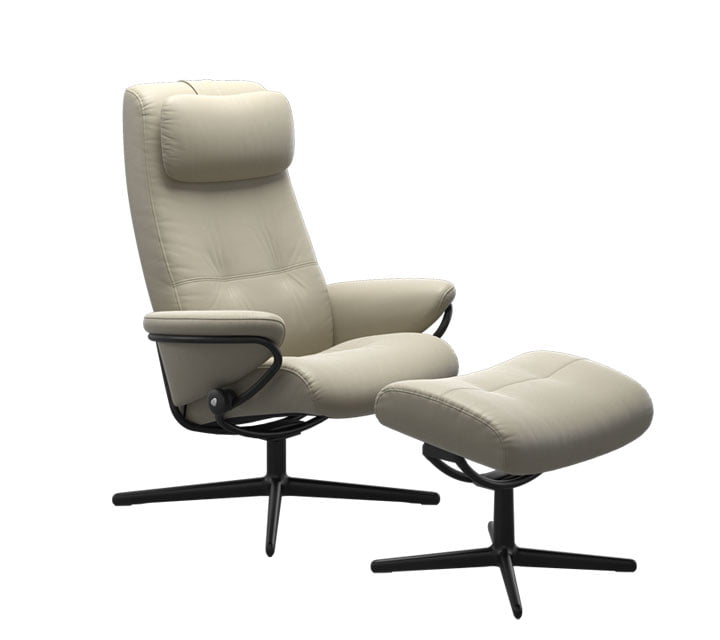 A high stressless recliner with a footstool