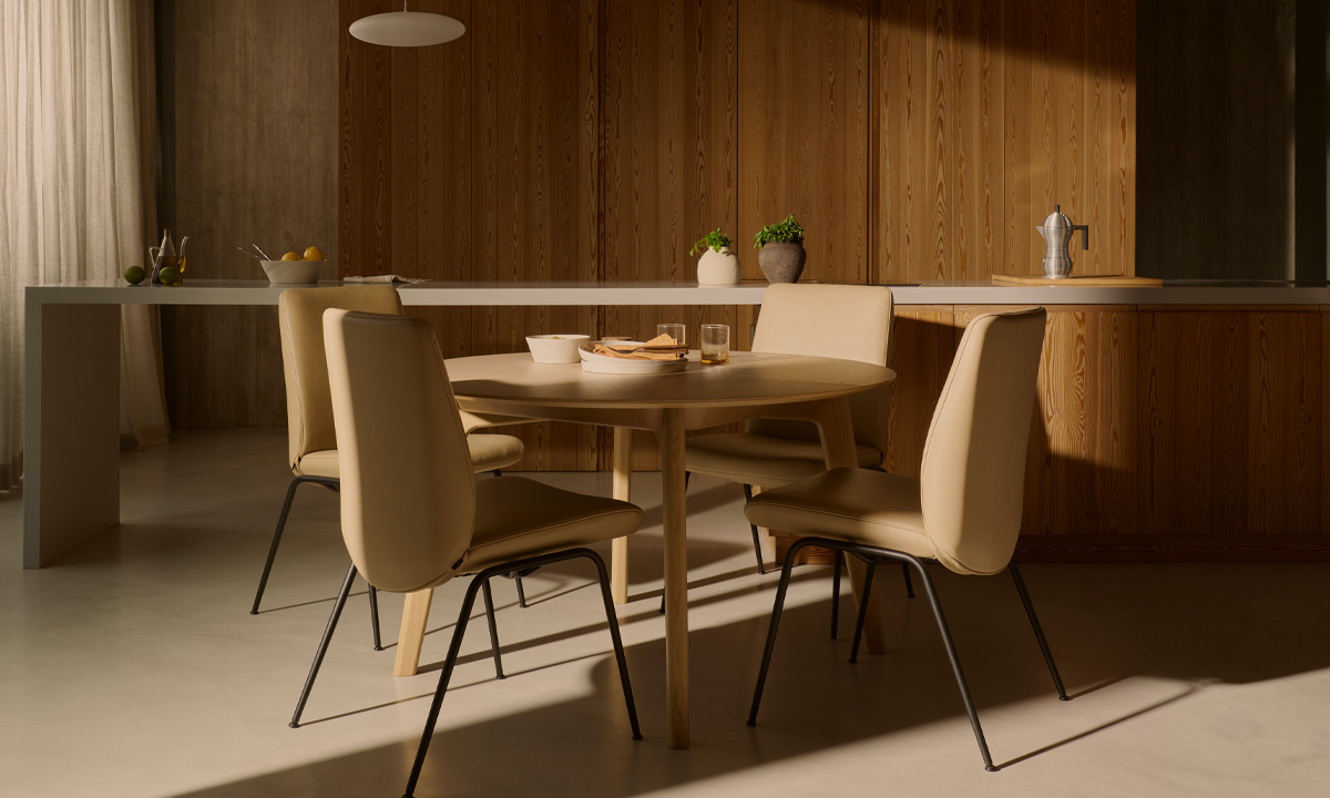 Party in room with Stressless® dining set-up