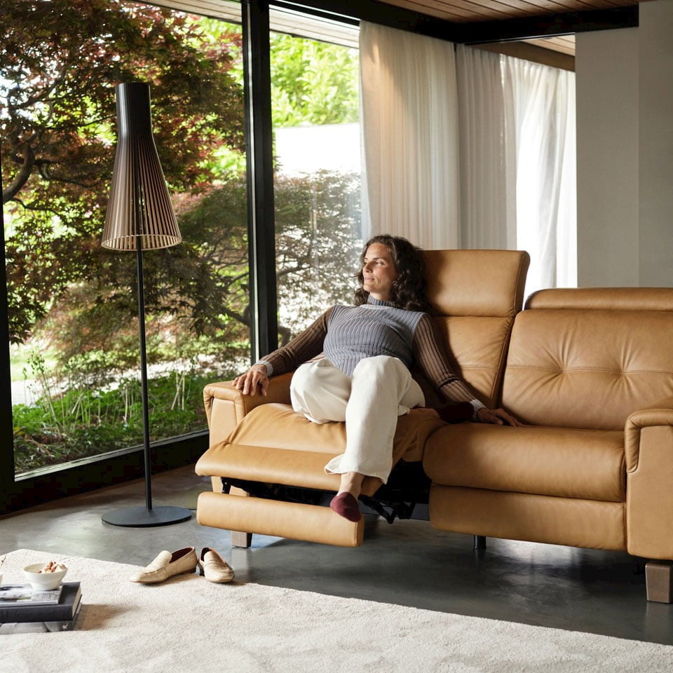 Woman relaxing in Stressless® Stella sofa