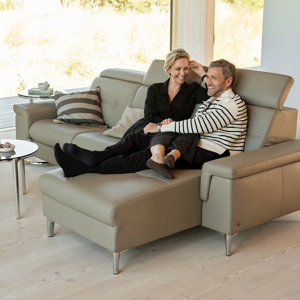 A man and a woman sitting in a sofa