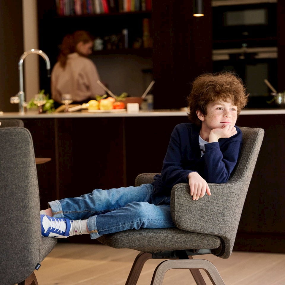 Boy in Stressless Vanilla dining chair