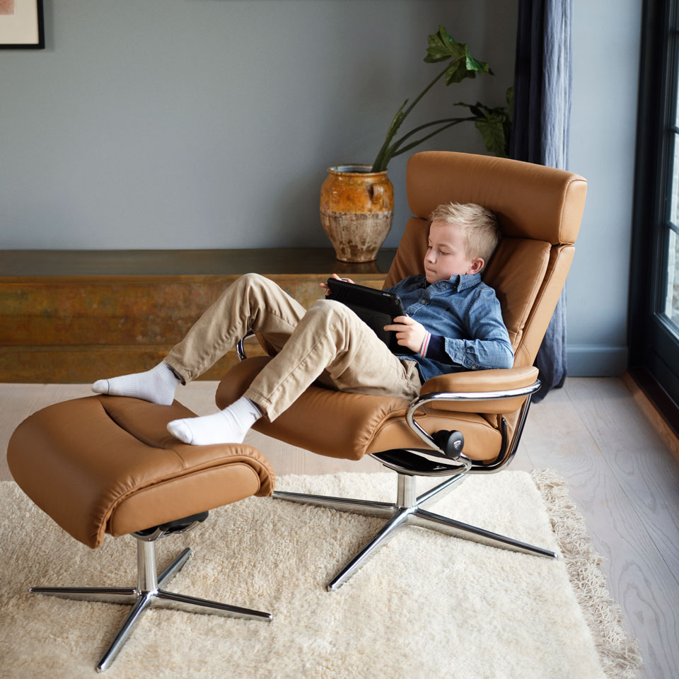 Boy watching ipad in Stressless Tokyo recliner