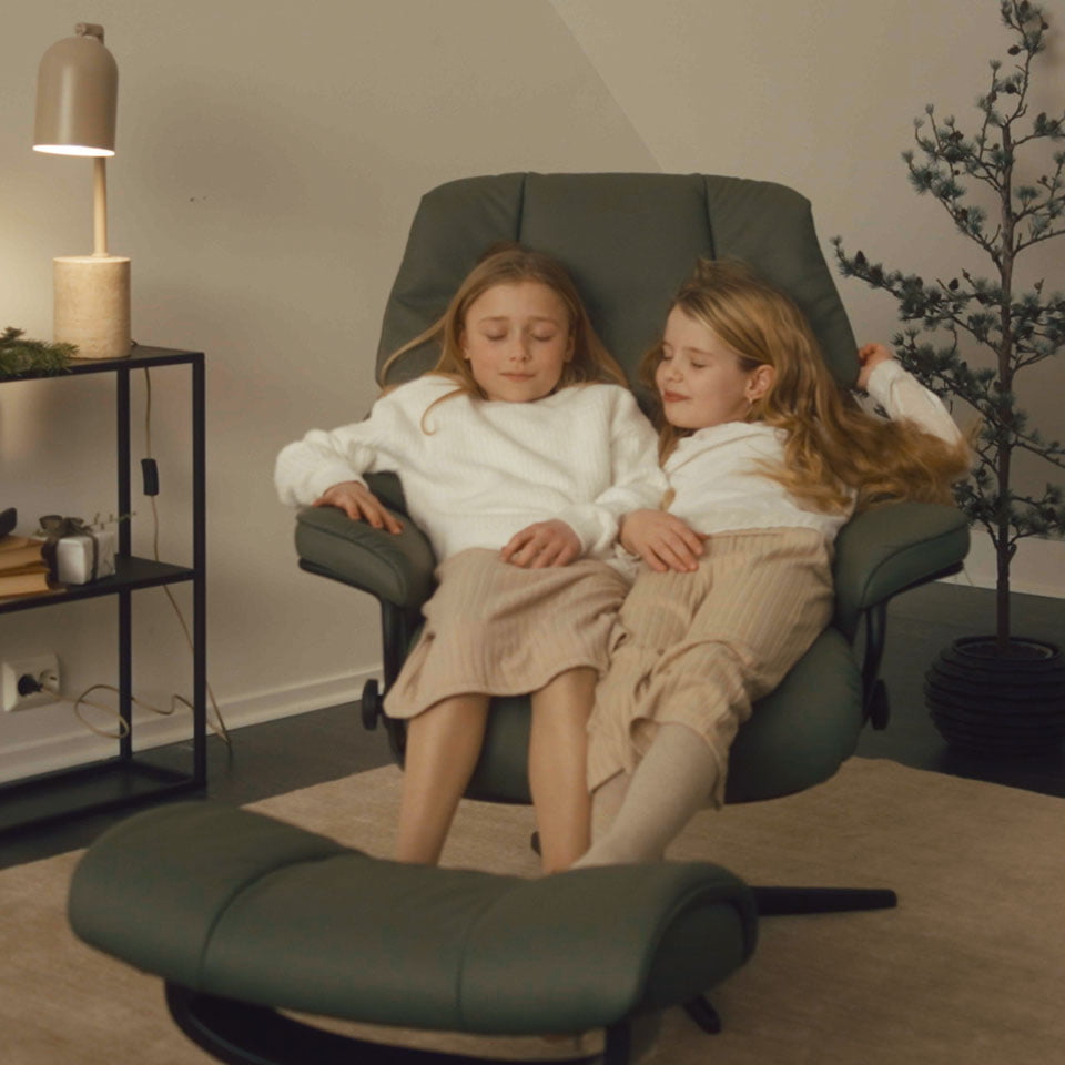 Girls sitting in Stressless Reno